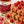 Waffle cake with raspberry nut butter and raspberries on a plate next to a jar of NuttyHero butter.